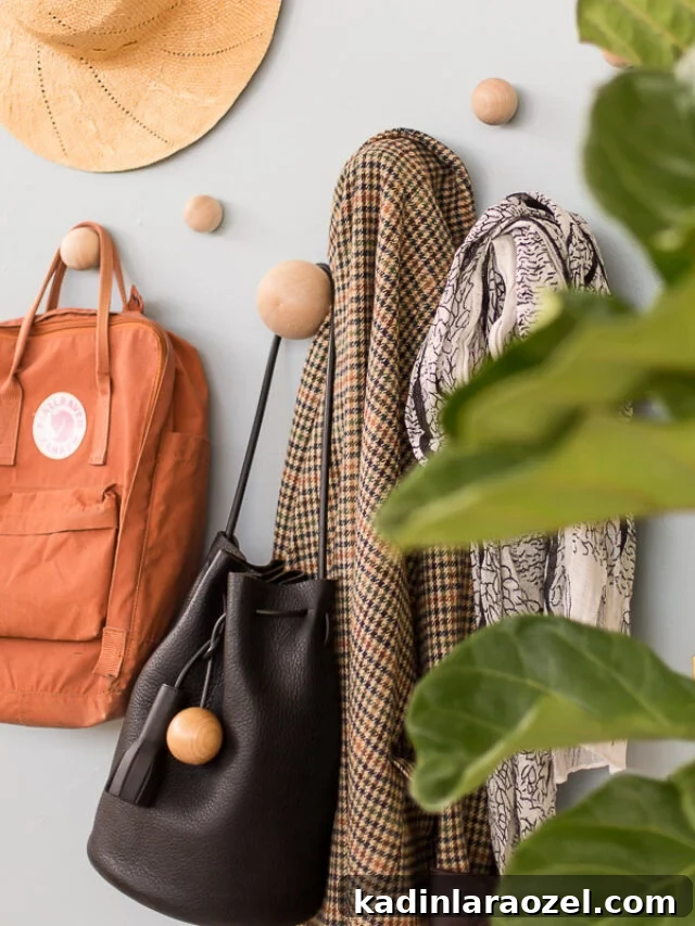 big wood round wall hooks with bags, jackets, and hats