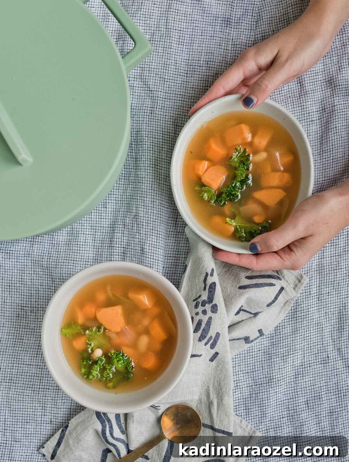 Where Have You Bean All My Life? Creamy White Bean Soup Recipe 5 Two bowls of white bean soup with hands.