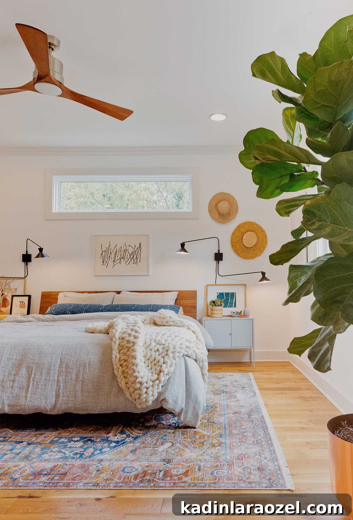Autumn Makeover: Cozy Updates for Our Master Bedroom 2 A modern bedroom that has been decorated for fall with a cozy blanket and rug.