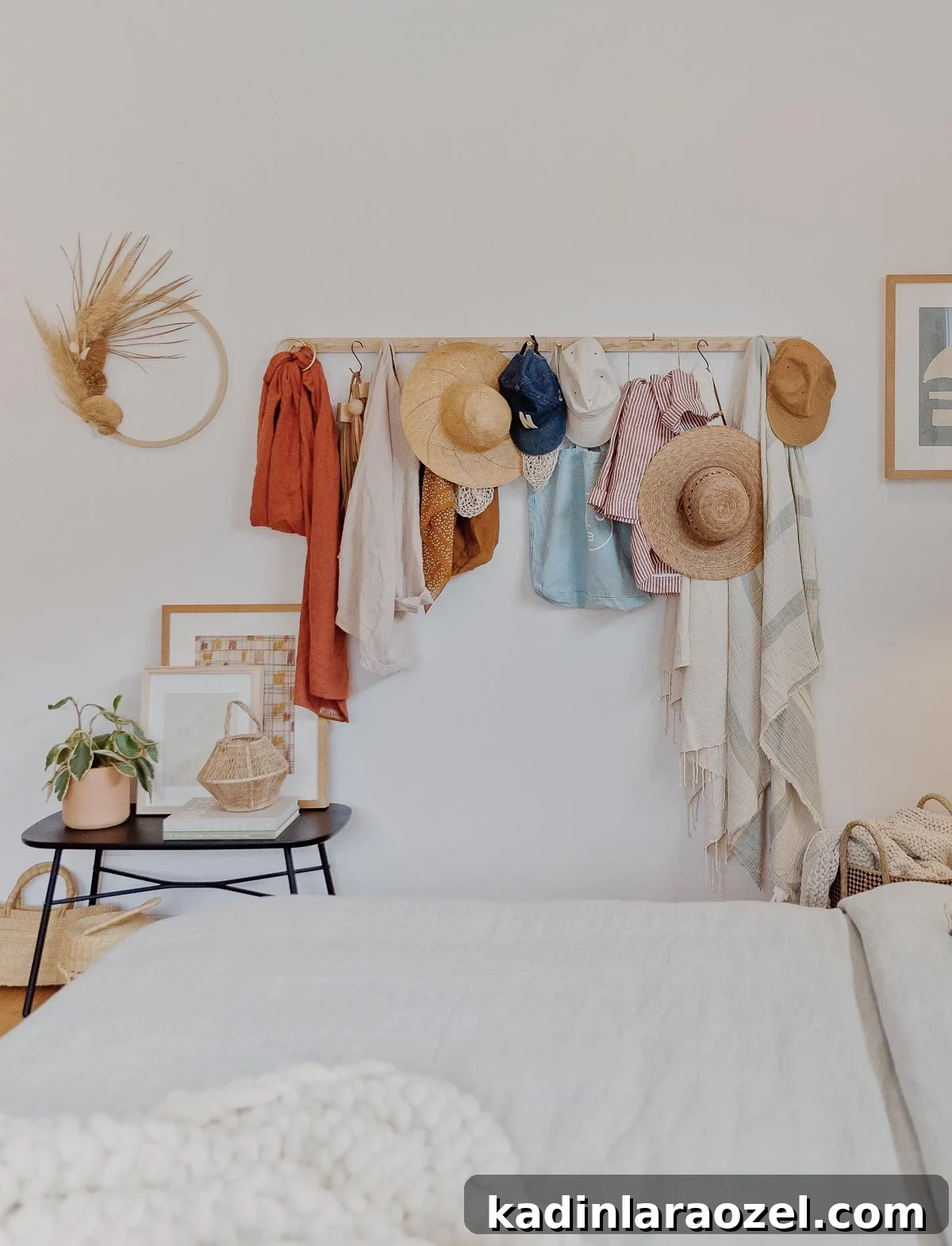 Autumn Makeover: Cozy Updates for Our Master Bedroom 5 A wood peg rail hangs on a white wall with hats, scarves, and bags.