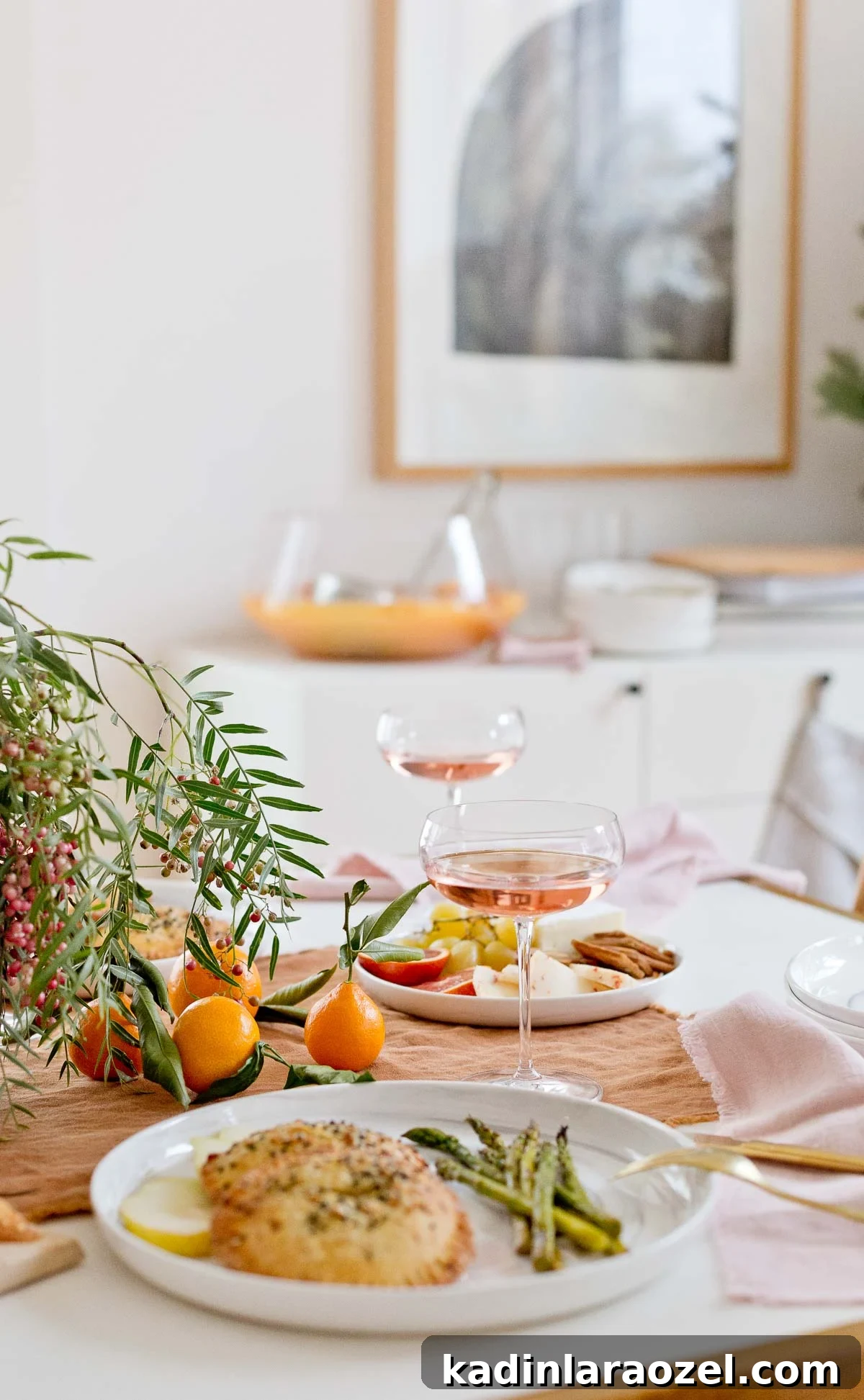 Dining table closeup with holiday dinner and two glasses of wine