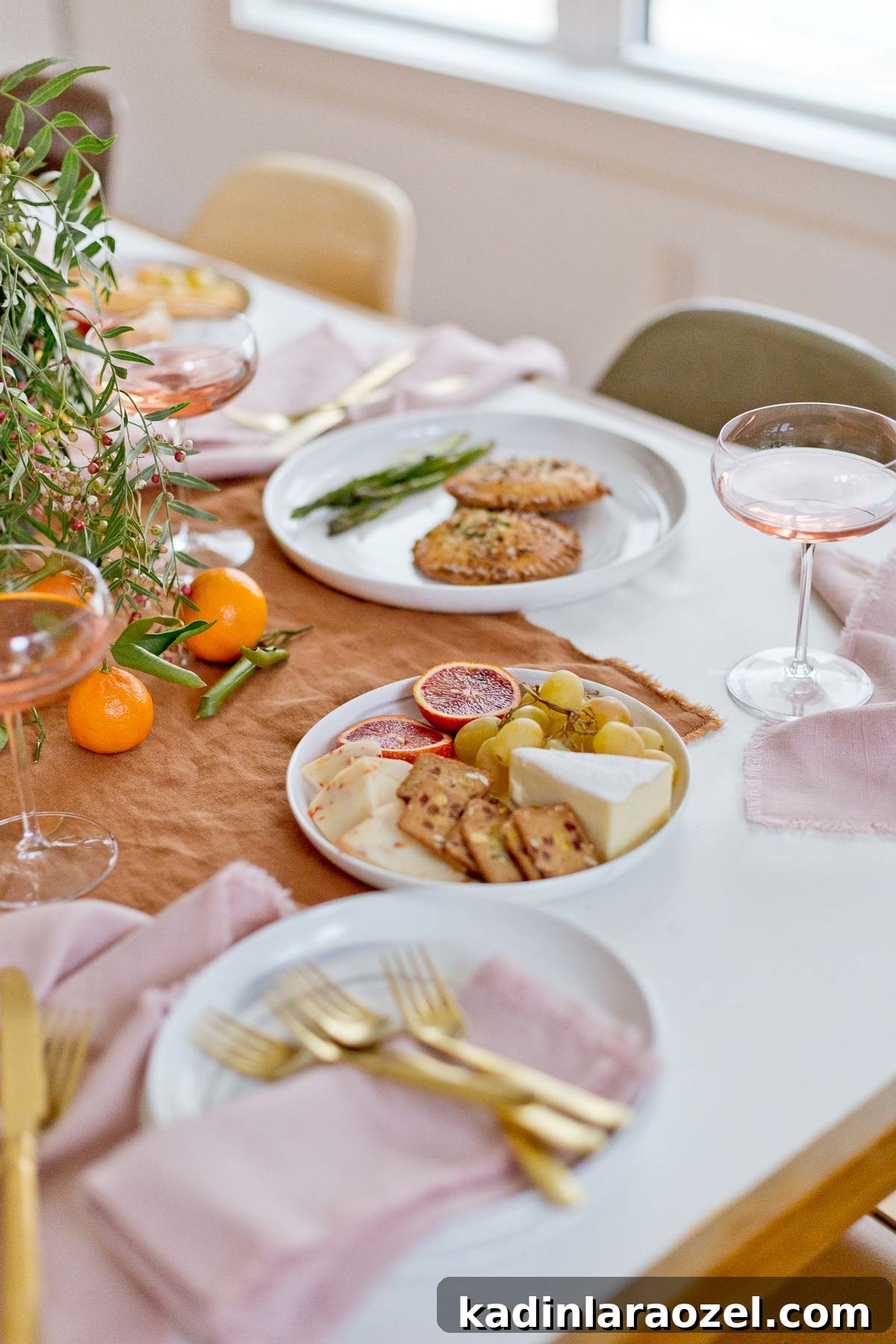 Holiday dinner tablescape closeup with holiday foods and wine