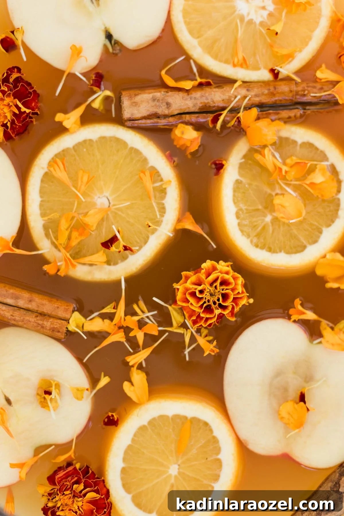 Apple and orange slices for spiked cider in punch bowl (batch cocktails for the holidays)