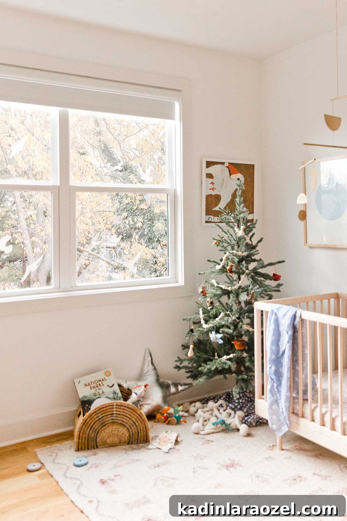 Holiday Nursery Decorating Ideas + Big Baby & Kids Holiday Gift Guide 10 Holiday decorating in a kids room - with a Christmas tree and metallic star pillows.