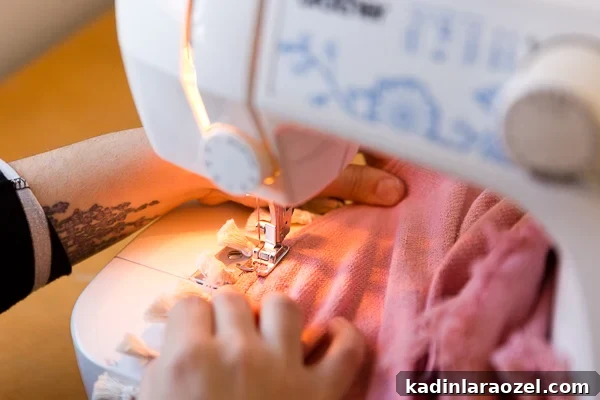 Sewing small tassels onto pink homemade tree skirt