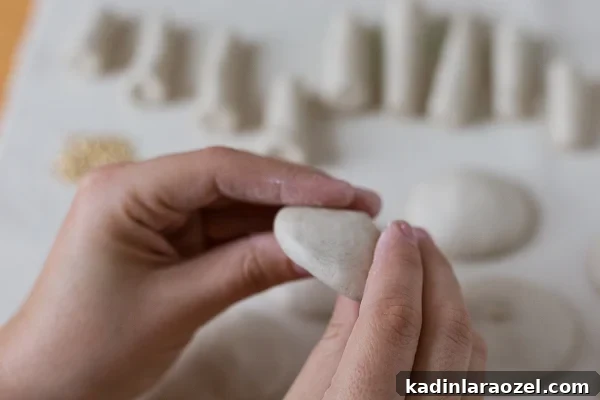 DIY Clay Mushroom Christmas Ornaments: Step-by-Step Guide 5 Push ball with thumbs to create mushroom cap shape