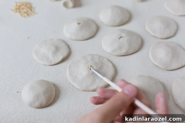 DIY Clay Mushroom Christmas Ornaments: Step-by-Step Guide 8 Use a paint brush to smooth out any parts of the clay that need it