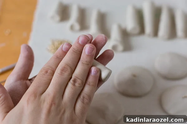 DIY Clay Mushroom Christmas Ornaments: Step-by-Step Guide 9 Roll out mushroom stem with clay between your fingers