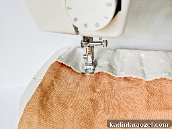 Finishing the sewing process for DIY fabric roll.