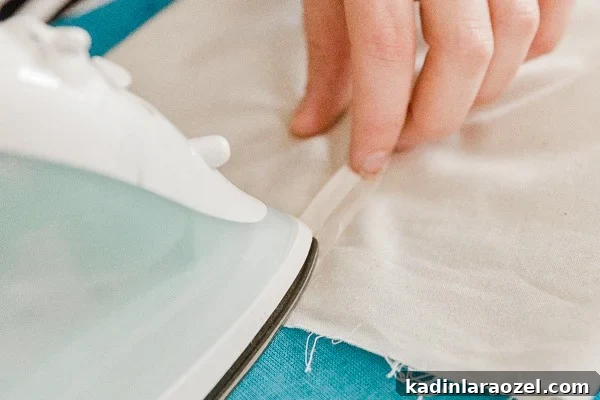 Make Reusable Produce Bags in 15 Minutes: DIY Sewing Guide 6 Ironing folds down for muslin reusable produce bags.