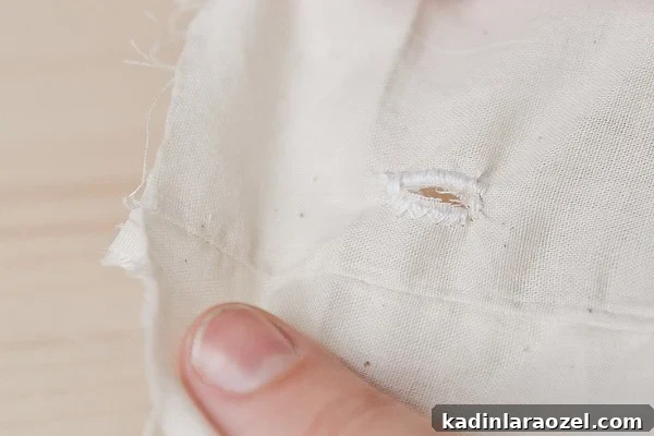 Make Reusable Produce Bags in 15 Minutes: DIY Sewing Guide 9 Crafting a button hole for produce bags.