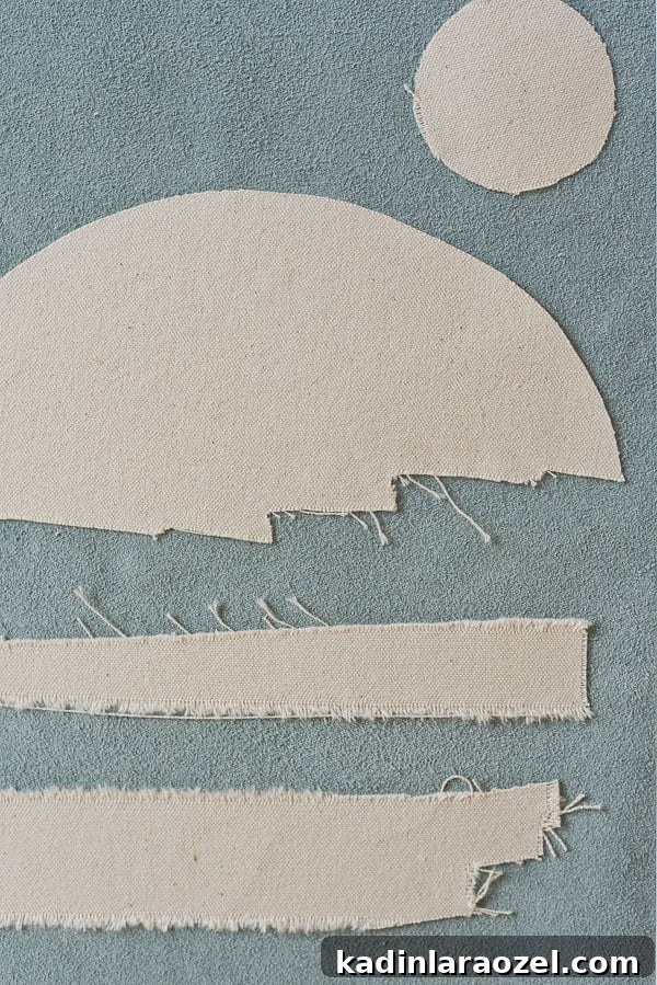 DIY art idea featuring a blue and raw canvas collage of a sunset