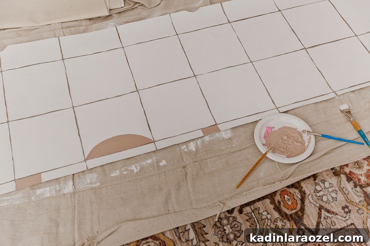 Painting beige geometric shapes on white vinyl flooring