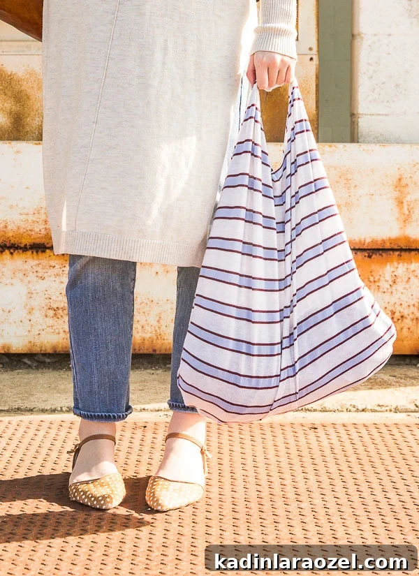 Closeup photo of striped grocery bag made out of a t-shirt.