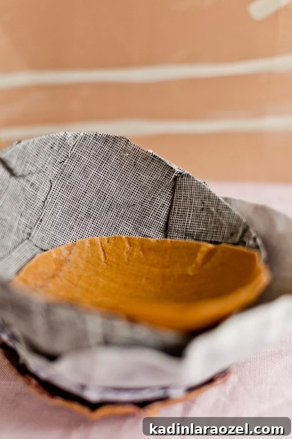Closeup detail of fabric paper mâché bowls stacked up together.