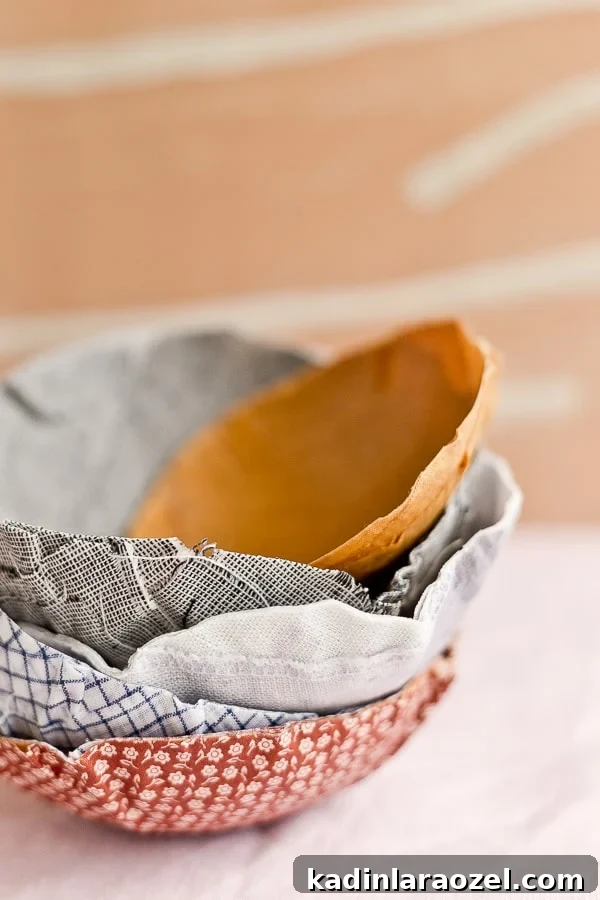 Stacked fabric bowls in various neutral colors.