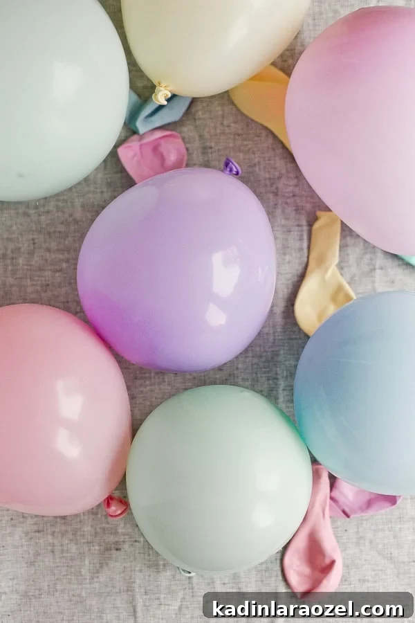 Colorful pastel balloons blown up on table.