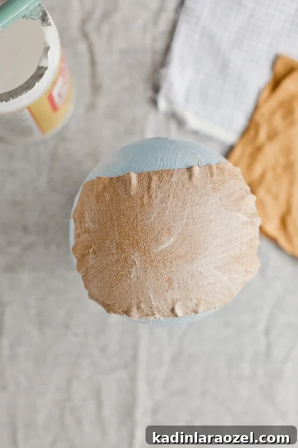 Large piece of fabric on a balloon with mod podge on top.
