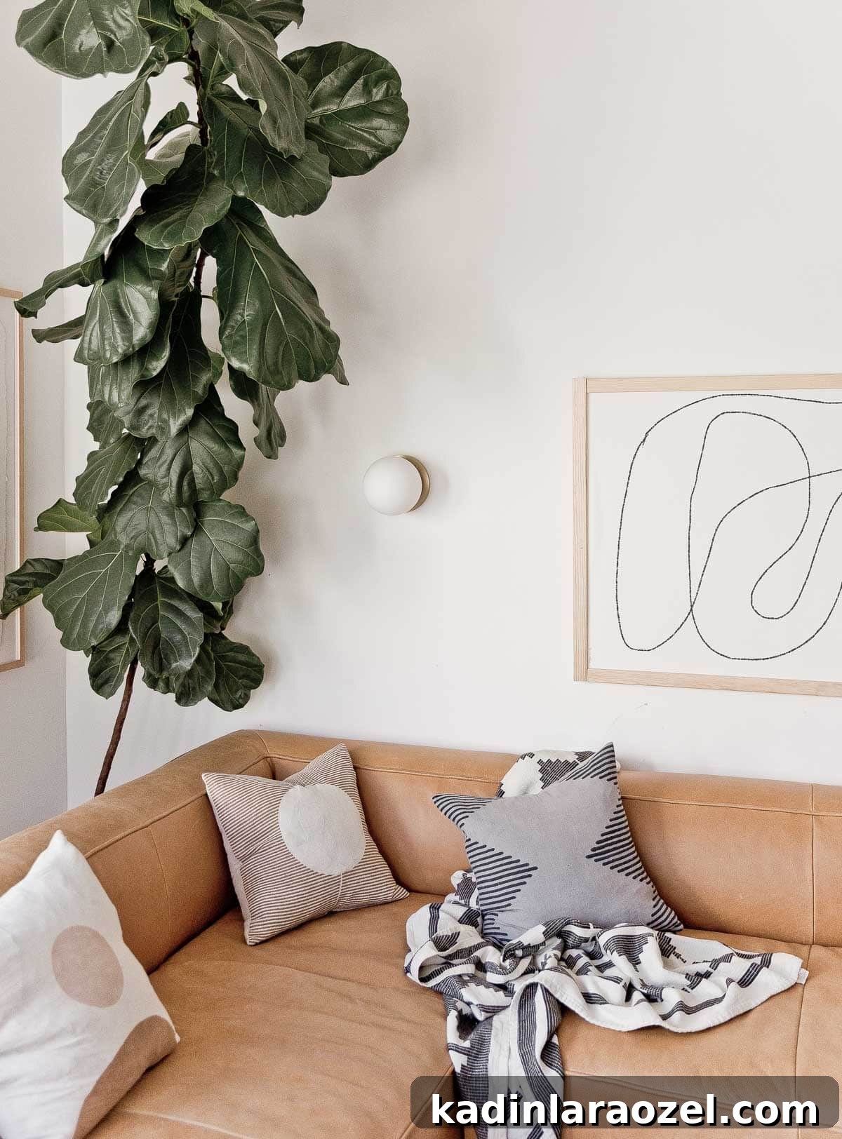 Where to Buy Art: Top Places to Find Original Artwork 6 Abstract black and white line drawing hanging in modern living room.
