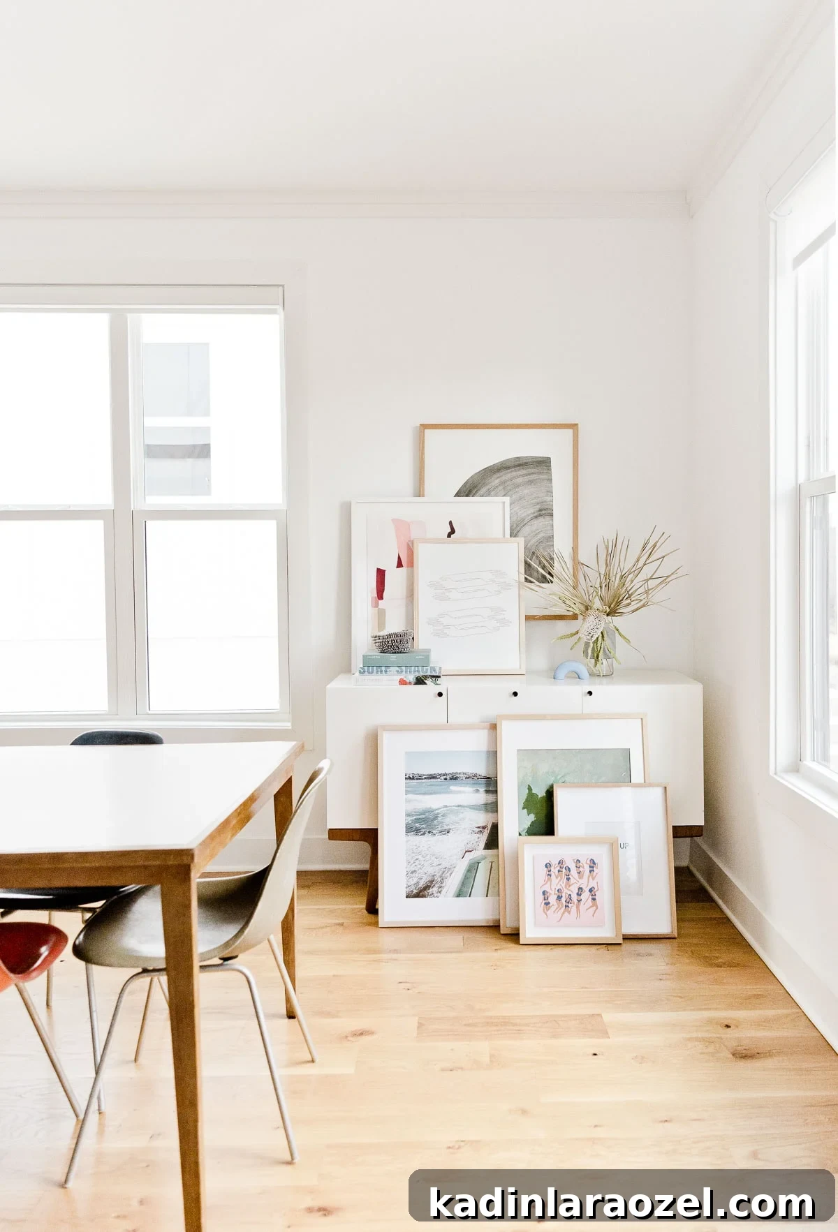 Where to Buy Art: Top Places to Find Original Artwork 7 Abstract artwork piled and leaning against a wall in modern home.
