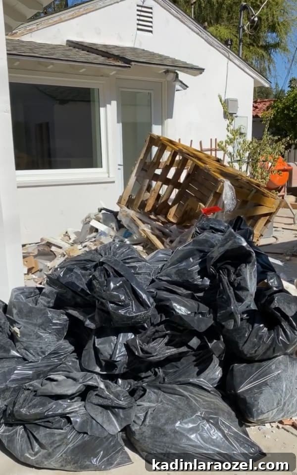 We Moved to California — Before Photos and Home Tour Updates 13 Before photos of construction with piles of garbage bags in backyard.