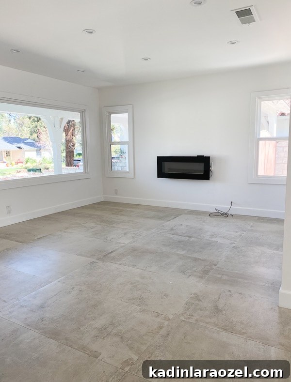 We Moved to California — Before Photos and Home Tour Updates 3 Empty living room (before photos) with concrete tile floors.