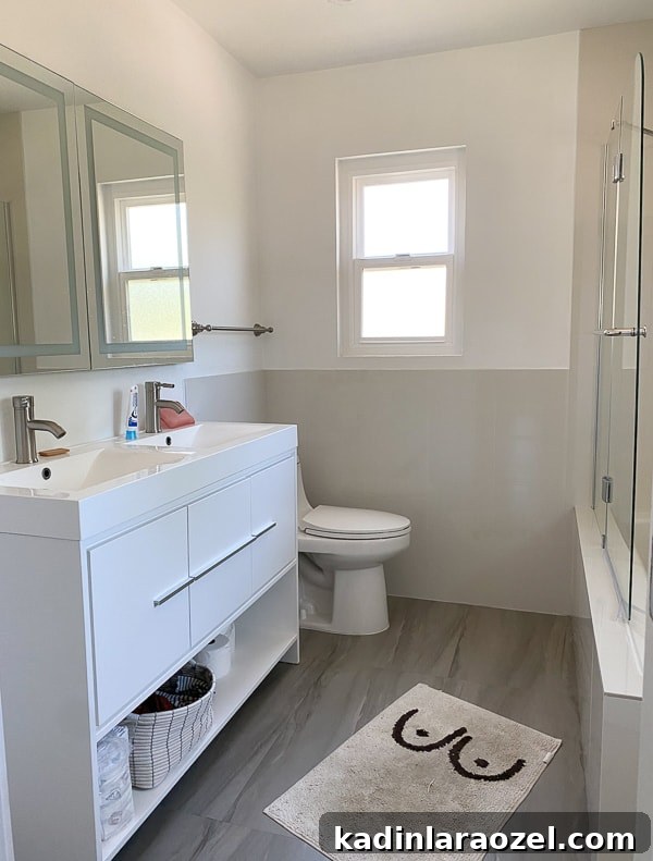 We Moved to California — Before Photos and Home Tour Updates 8 Before photo of basic rental bathroom with white vanity.