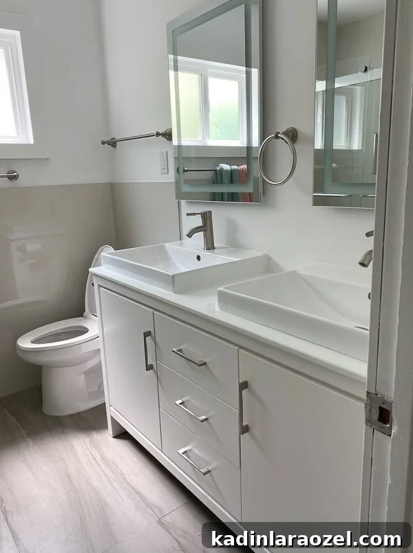 We Moved to California — Before Photos and Home Tour Updates 9 Guest bathroom (before photo) with white vanity and large mirrors.