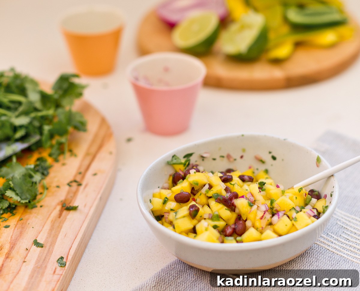 closeup of mango salsa in small bowl on countertop