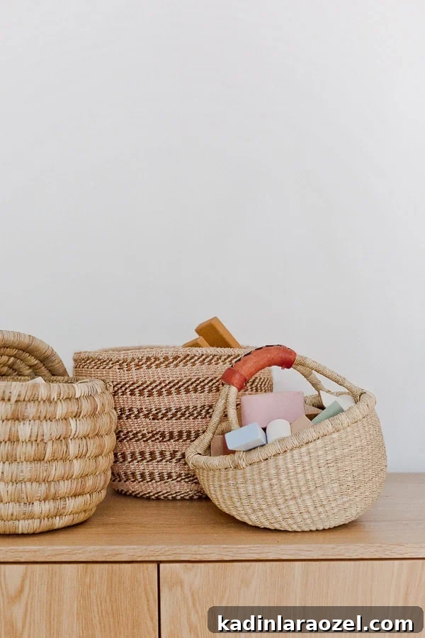 Where to Find Stylish Woven Storage Baskets Online and In-Store 5 Three woven baskets, sitting on top of a credenza, with toys inside.