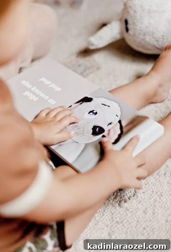 Create a Personalized Baby Board Book: 3 Creative DIY Methods 13 Image of toddler reading a board book, sitting on the floor.