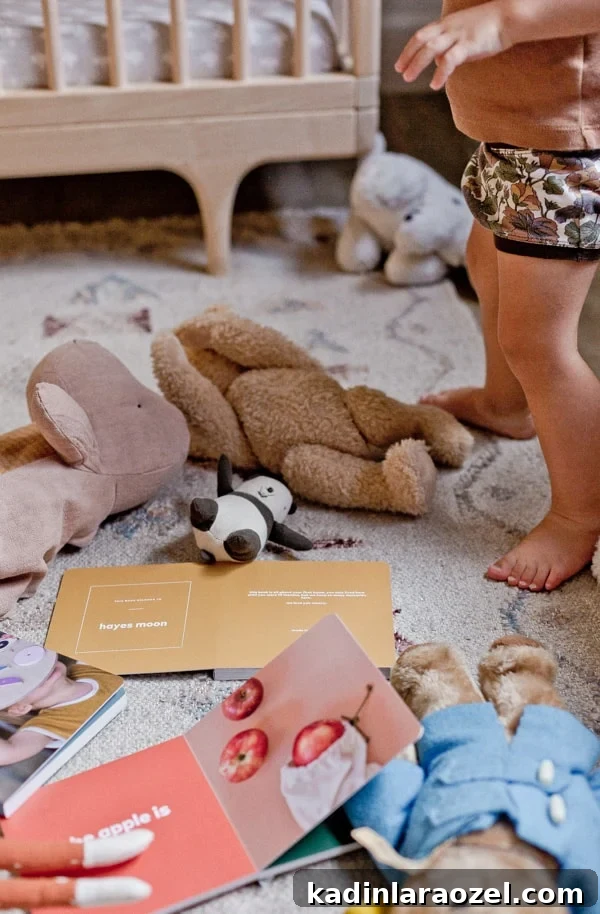 Create a Personalized Baby Board Book: 3 Creative DIY Methods 3 Photo of colorful board books on the ground with toys surrounding it.