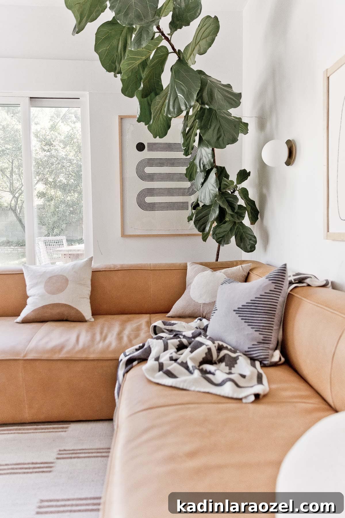 Lounge Room Makeover: In-Depth Furniture Review and Guide 11 Image of modern, leather corner sofa with earthy, neutral textiles.