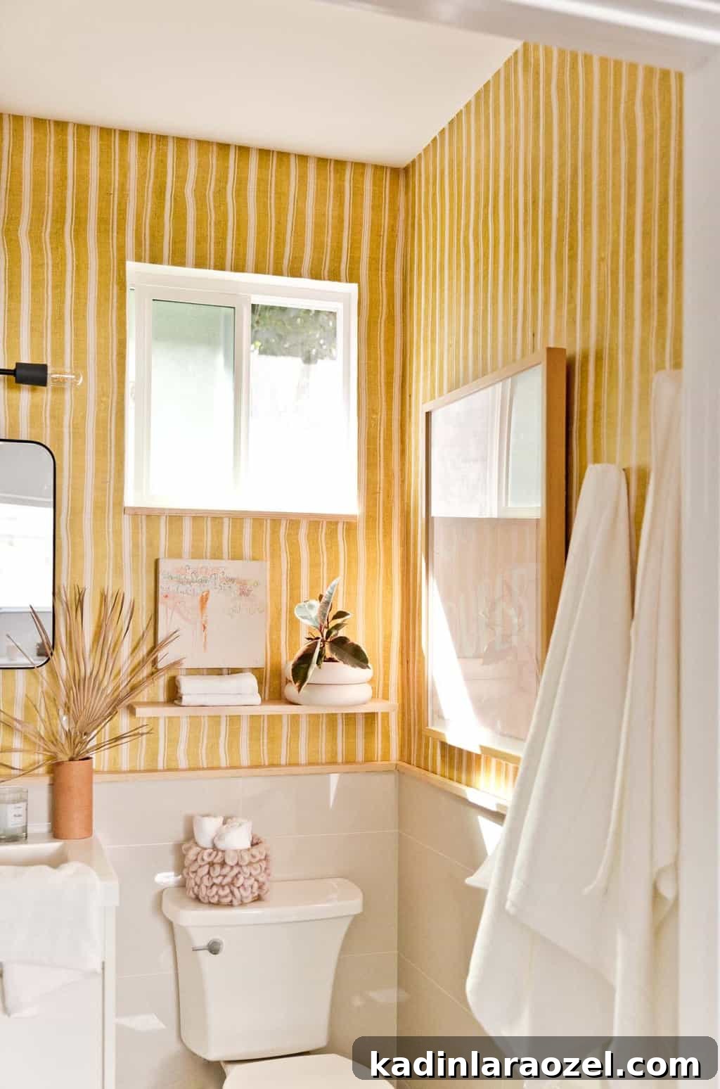 Yellow Bathroom Reveal: Stylish Renter-Friendly Makeover 2 Image of a modern, yellow bathroom with striped wallpaper.
