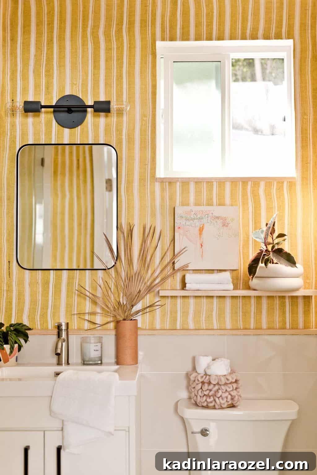Yellow Bathroom Reveal: Stylish Renter-Friendly Makeover 11 Yellow striped bathroom with black modern accents and natural elements.