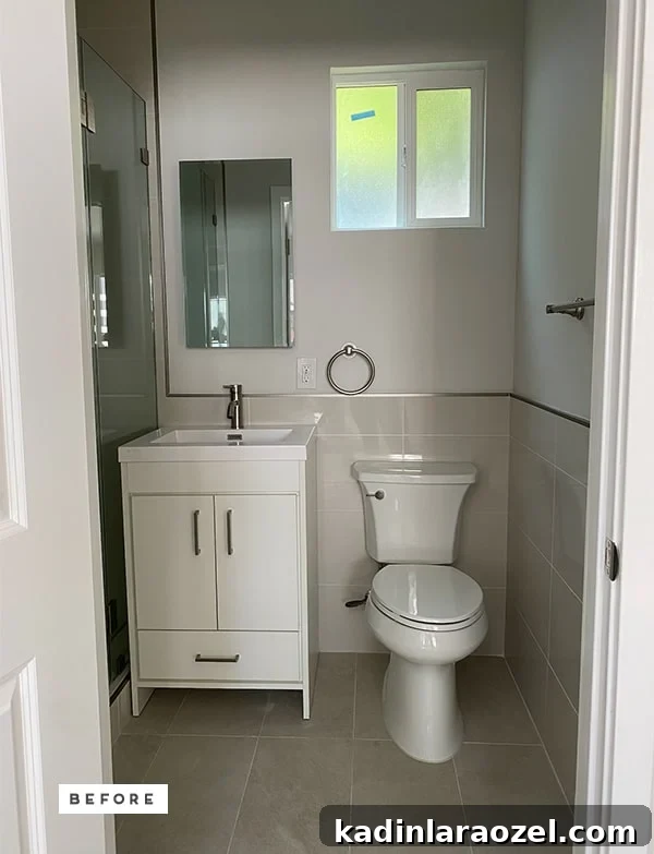 Yellow Bathroom Reveal: Stylish Renter-Friendly Makeover 3 Photo of basic, neutral, small renter's bathroom.