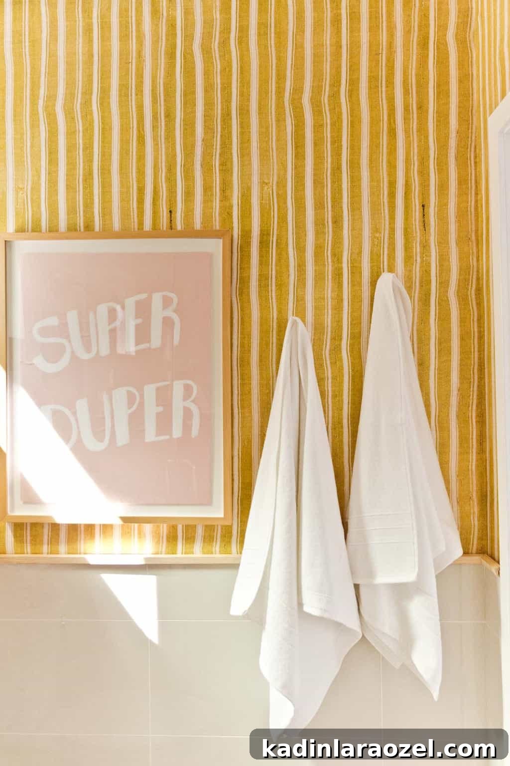 Yellow Bathroom Reveal: Stylish Renter-Friendly Makeover 7 Super Duper graphic artwork in bold bathroom with stripes.