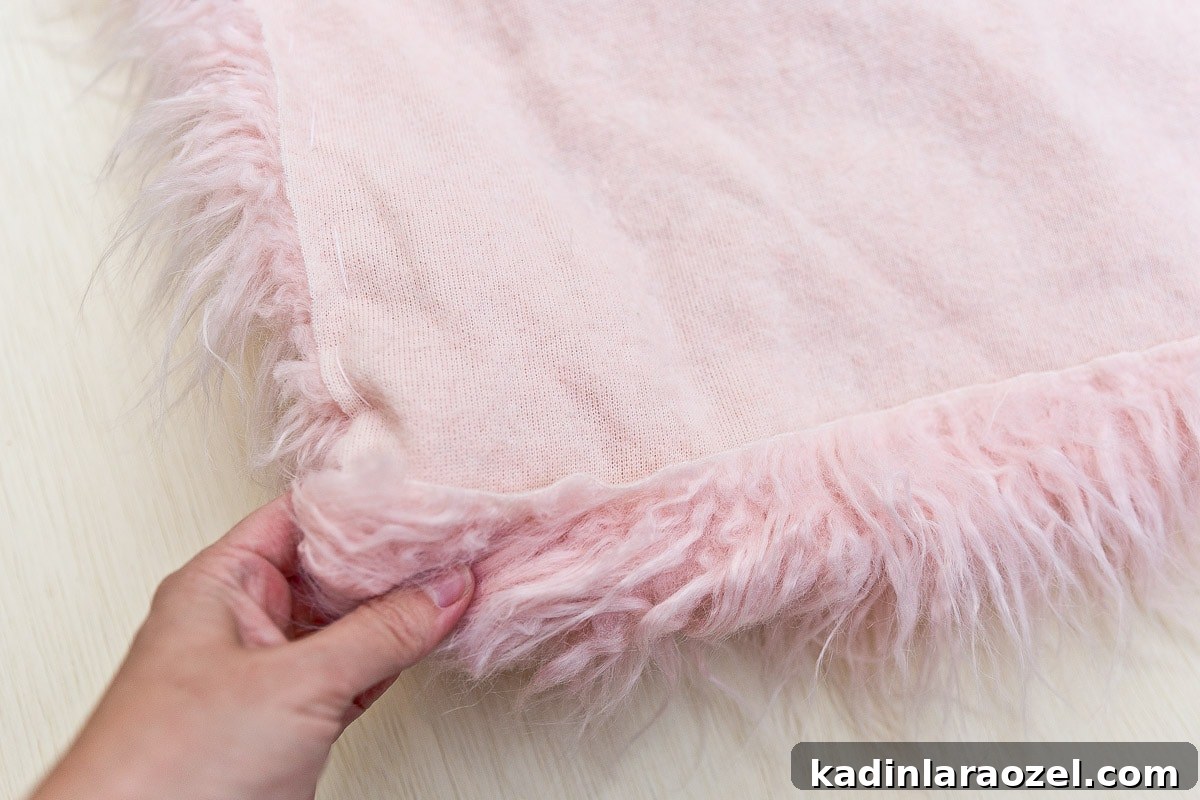 Pink fur fur being made not a bird costume for Halloween.