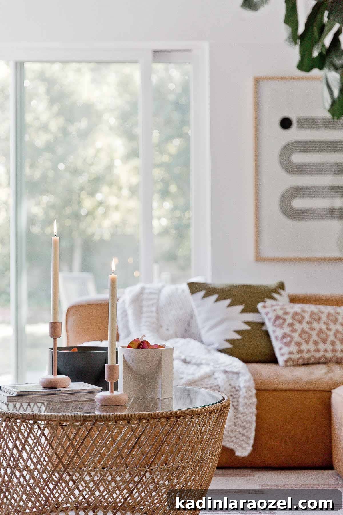 Modern candlesticks and funky sculptural bowls on an earthy, rattan coffee table.