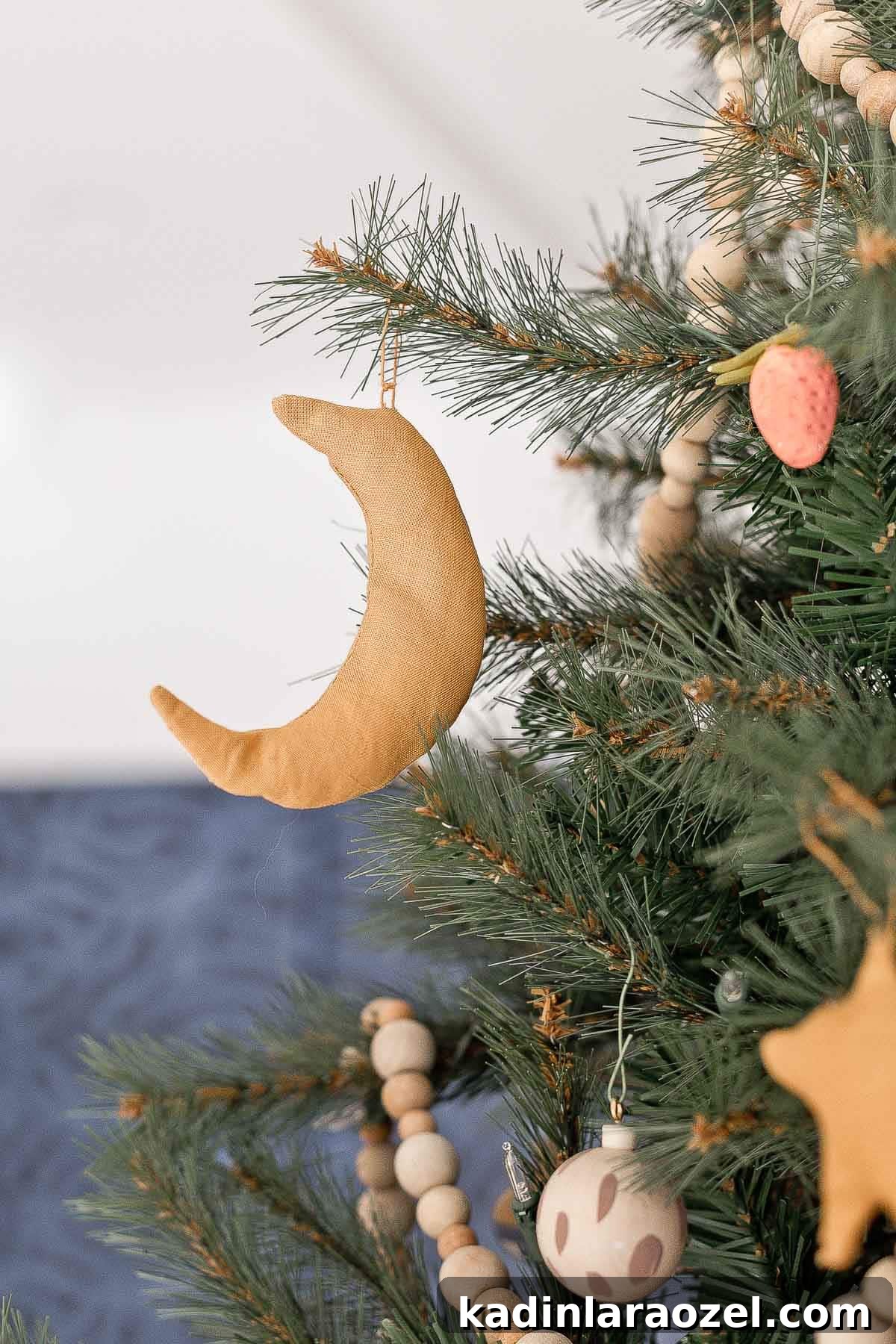 Moon ornament hanging on a Christmas tree