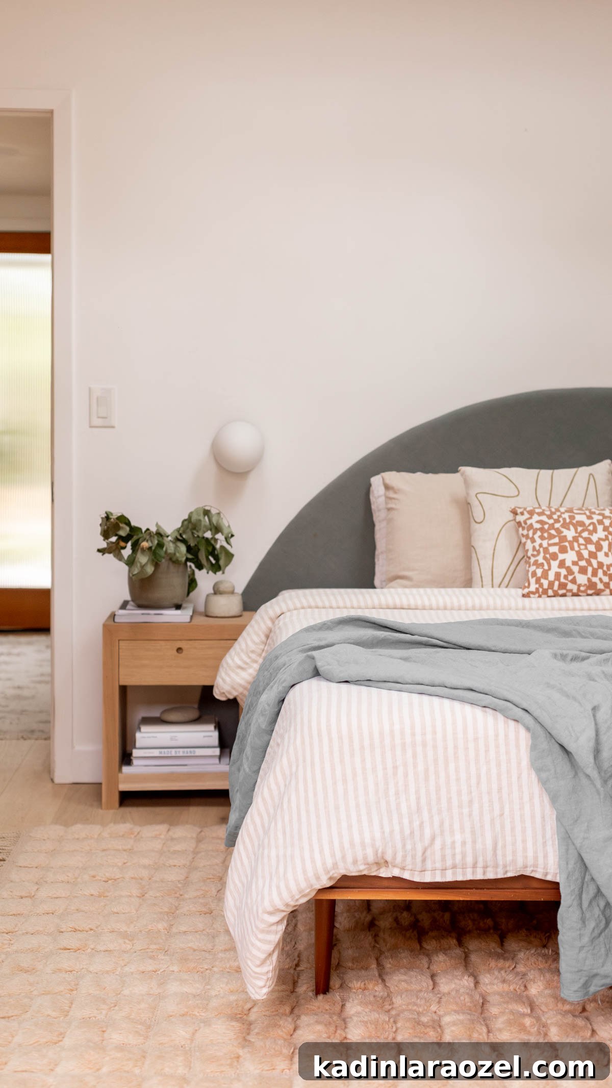 Statement-Making DIY King Size Half-Circle Headboard 16 organic modern bedroom with neutral textured rug and round earthy greenish blue linen headboard