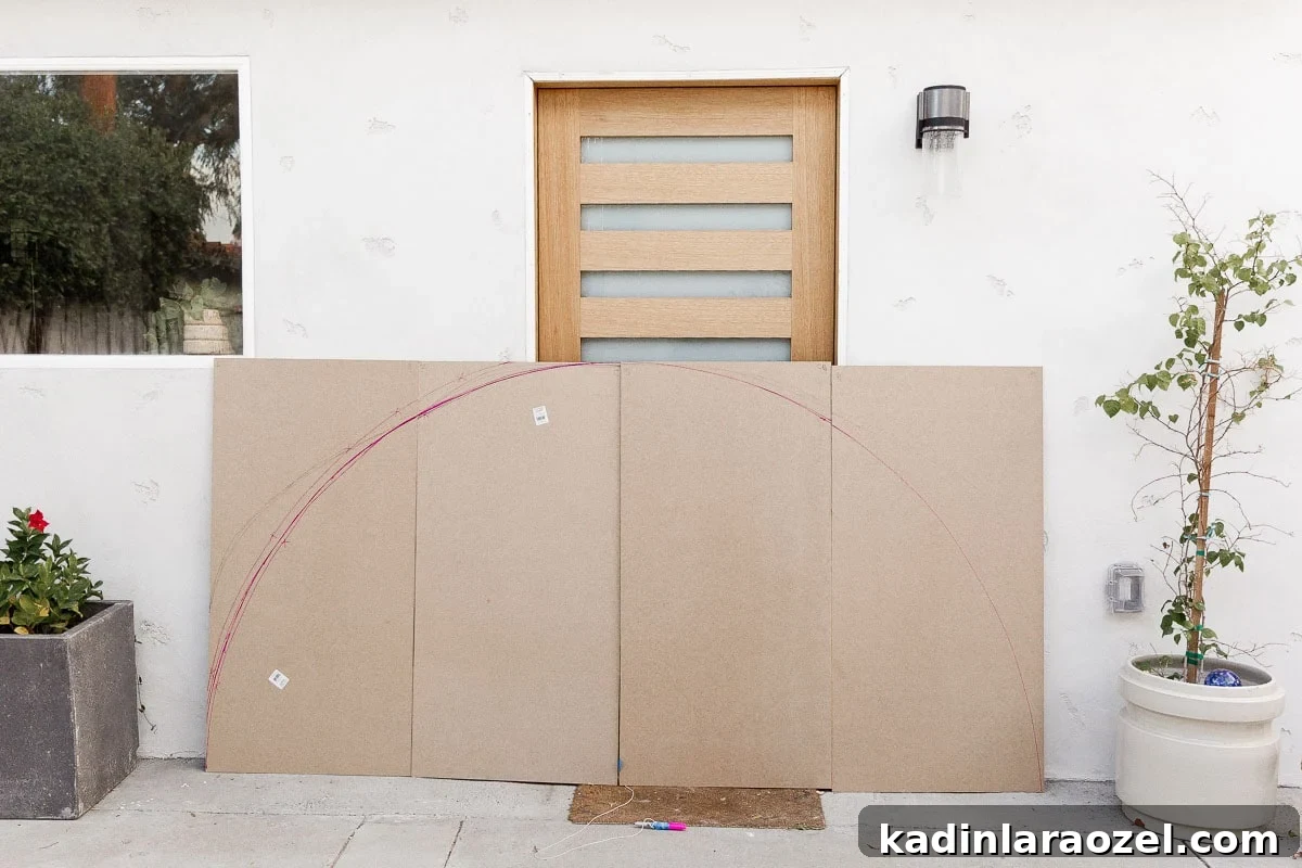 Statement-Making DIY King Size Half-Circle Headboard 4 Drawing out half circle headboard on MDF panels.