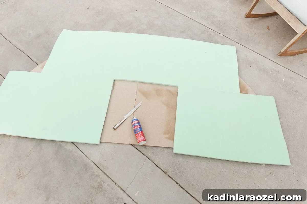 Statement-Making DIY King Size Half-Circle Headboard 9 Attaching upholstery foam to MDF panels to make a statement headboard.
