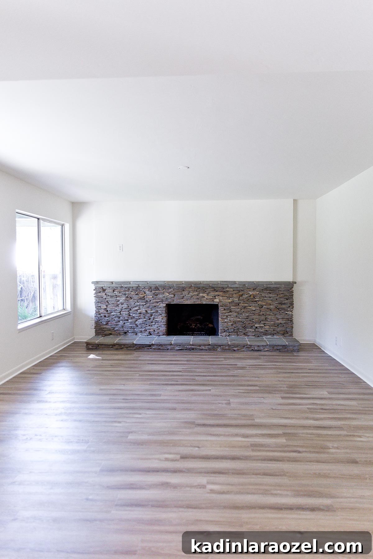 Fireplace Makeover Before & After: Stunning Transformations and Ideas 2 giant ledger rock fireplace in empty house with white walls
