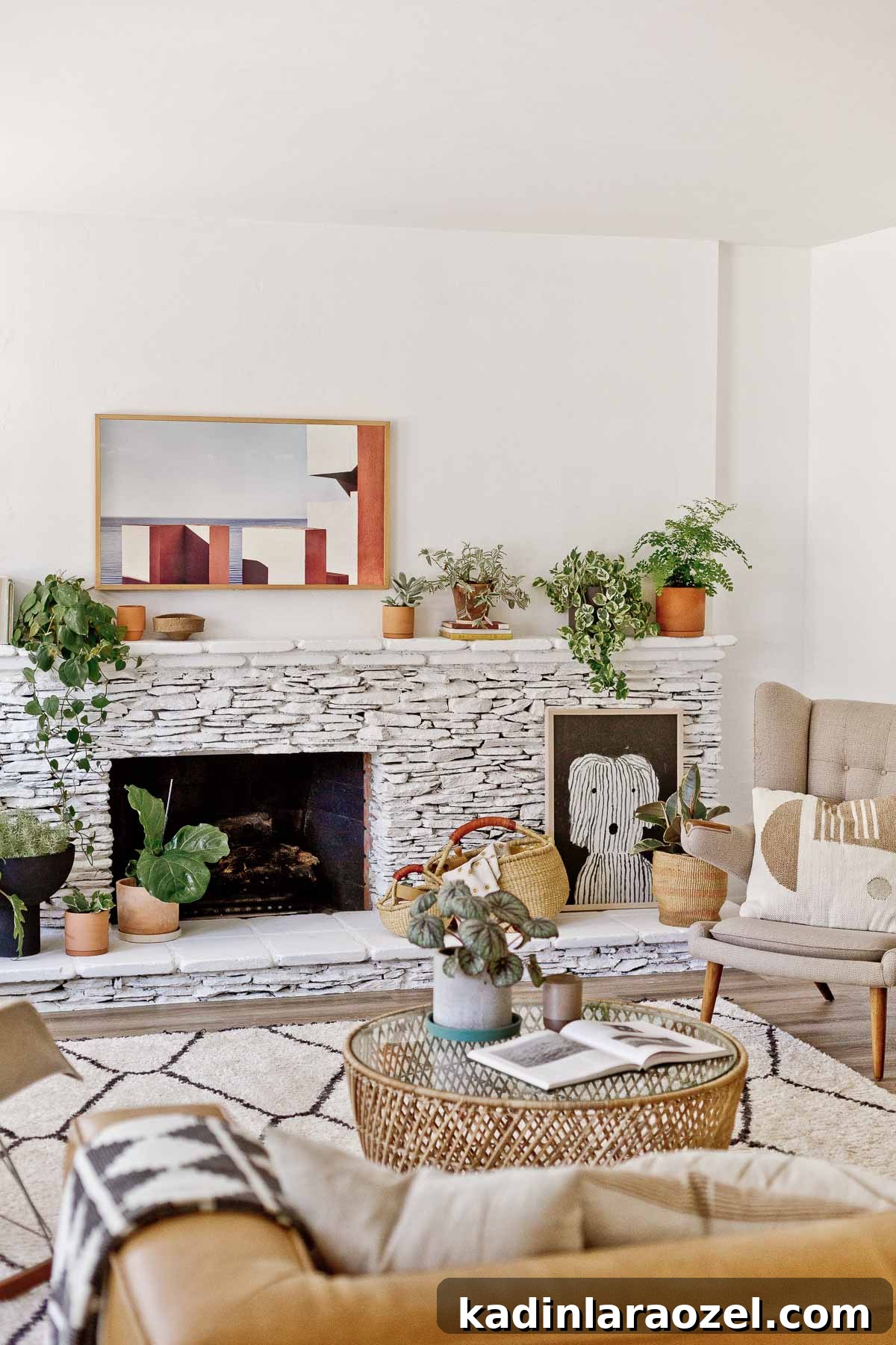 Fireplace Makeover Before & After: Stunning Transformations and Ideas 8 painted white stone fireplace with plants and large neutral artwork