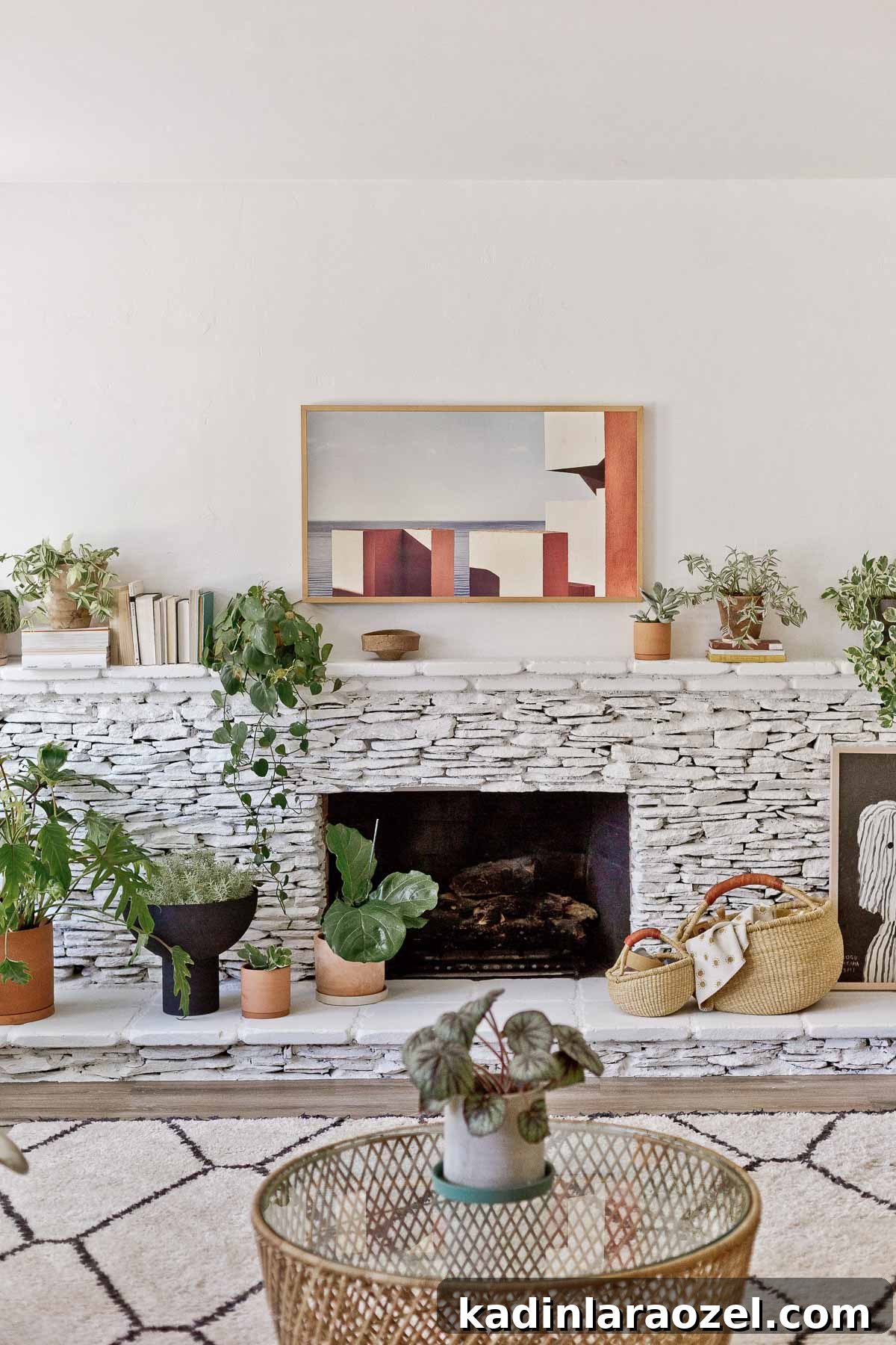 Fireplace Makeover Before & After: Stunning Transformations and Ideas 9 stacked stone fireplace, painted white with plants and organic modern decor