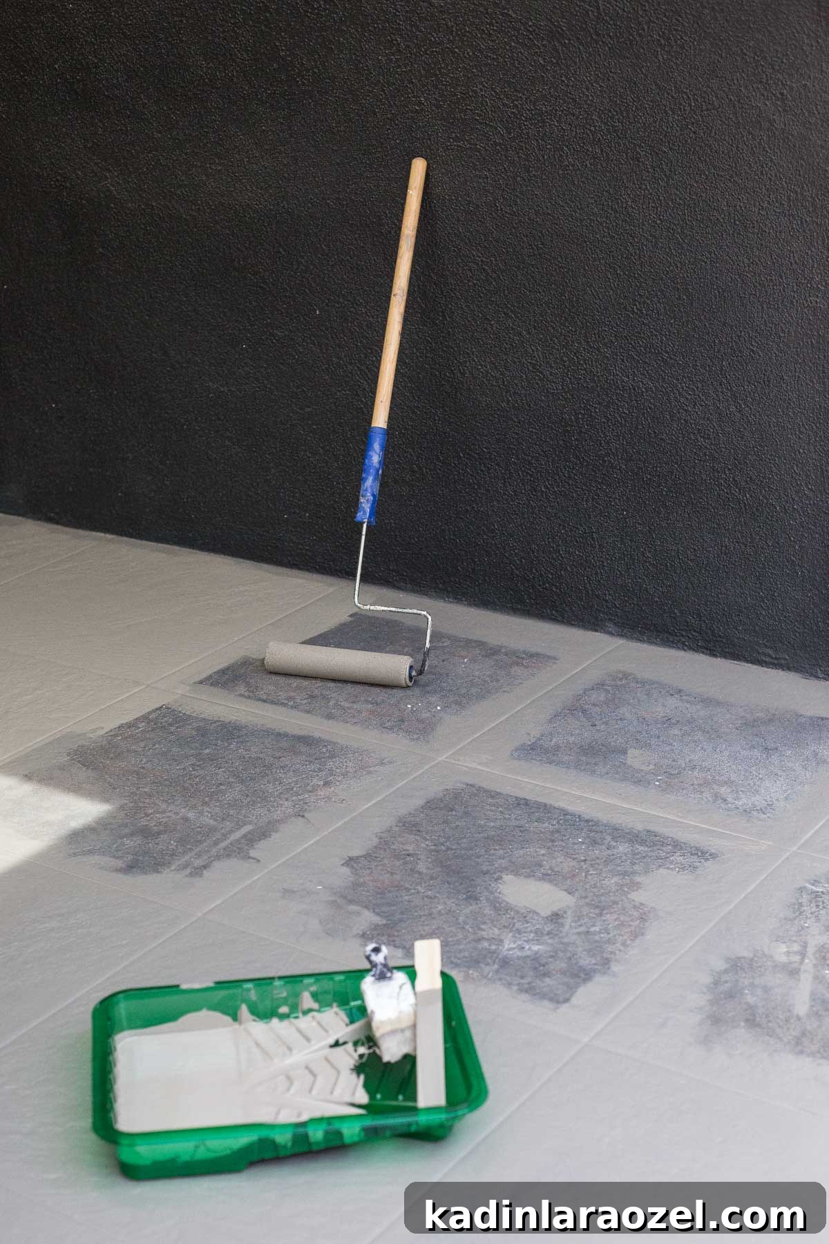Porch Tile Painting Guide: Transform Your Floor in One Weekend 6 Painting floor tiles with a pant roller and brush.