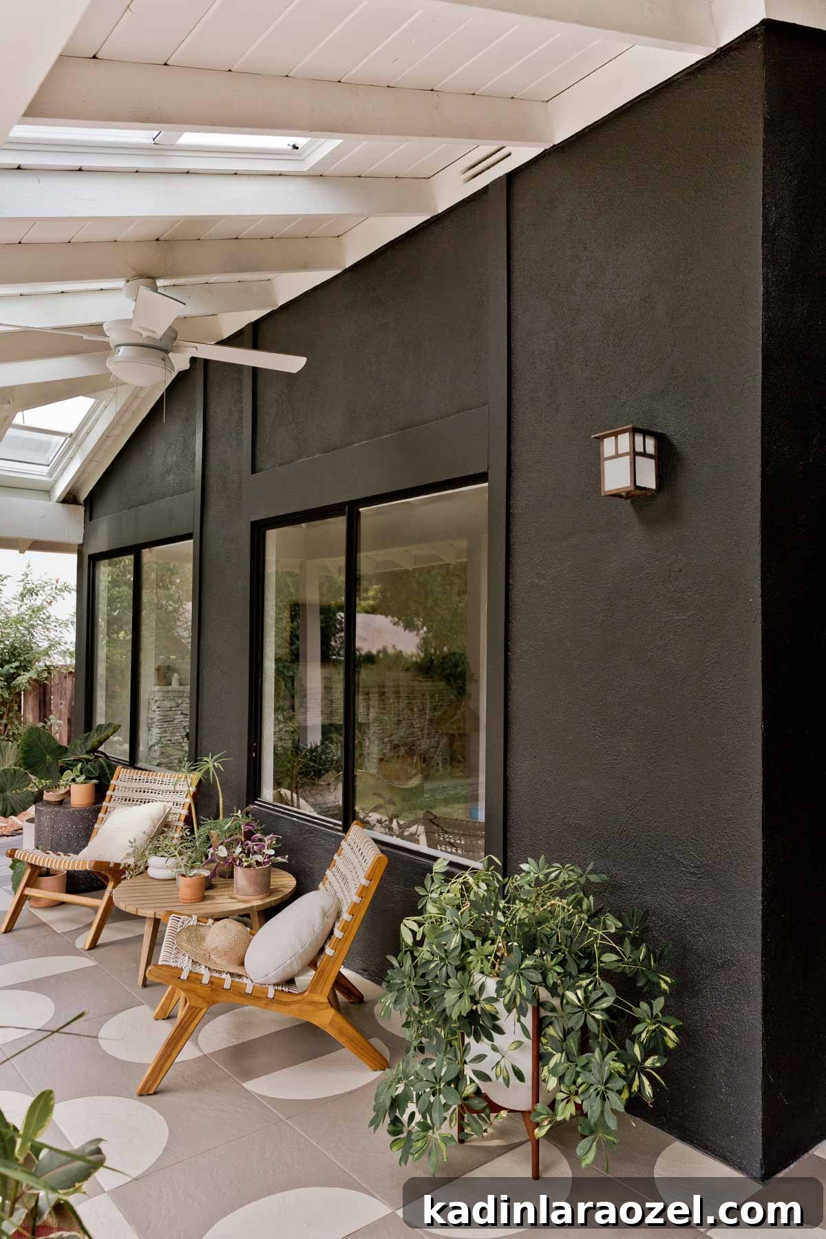 Porch Tile Painting Guide: Transform Your Floor in One Weekend 9 Modern front porch with black exterior and painted pattern tile flooring.