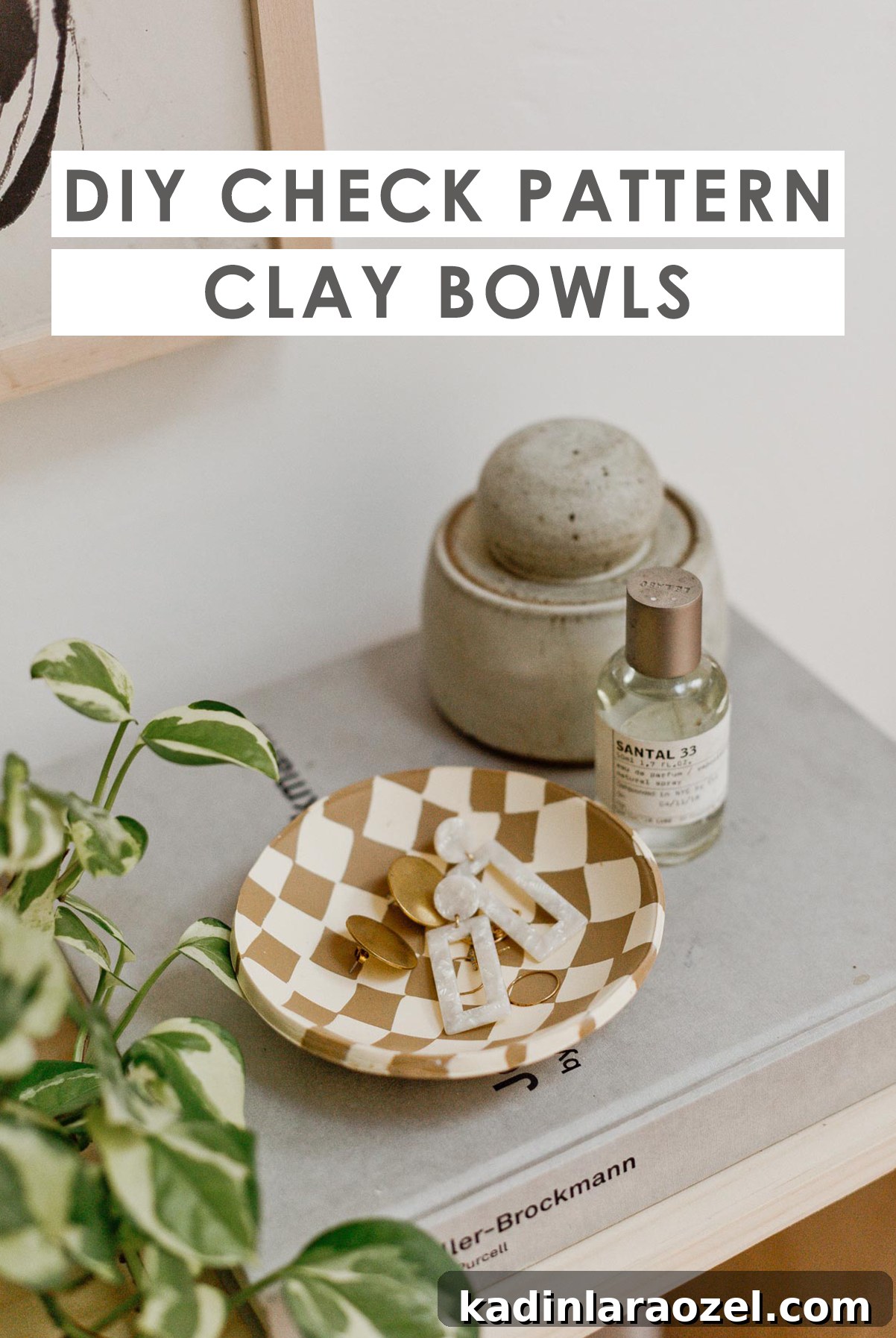 Closeup of check print clay bowls with earrings inside.