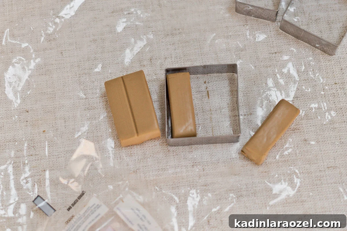 Cutting oven bake clay with cookie cutters.